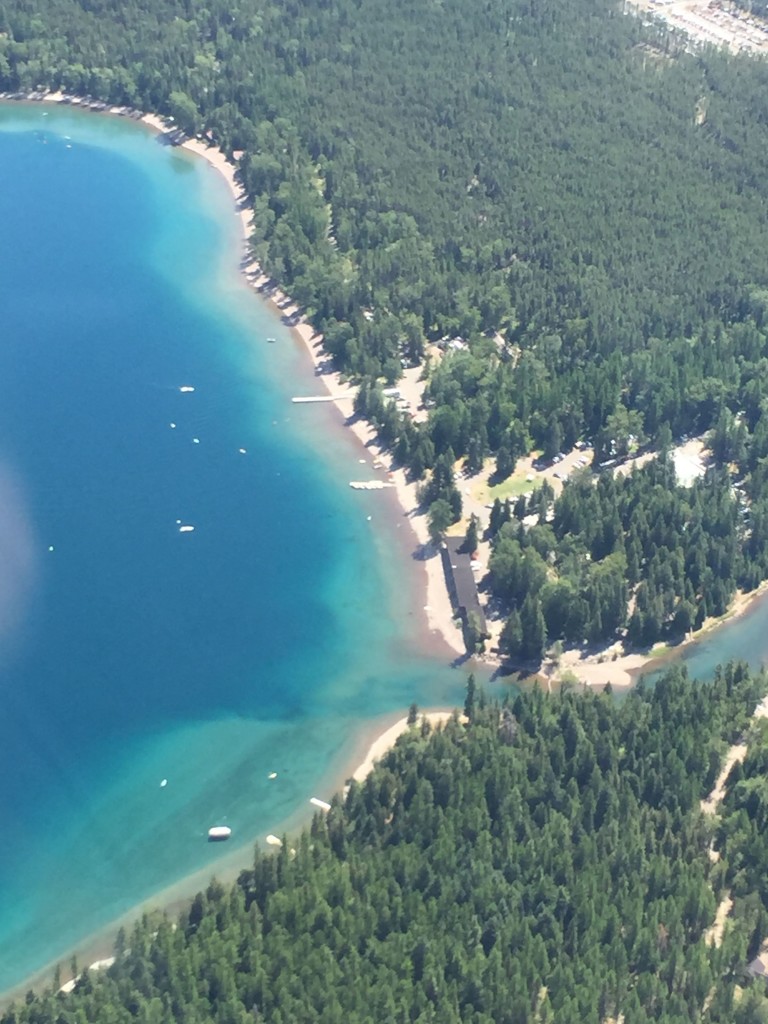 Glacier National Park by helicopter. St. Mary’s Lodge below on Lake McDonald.